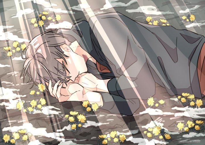 Boy sleeping among yellow flowers
