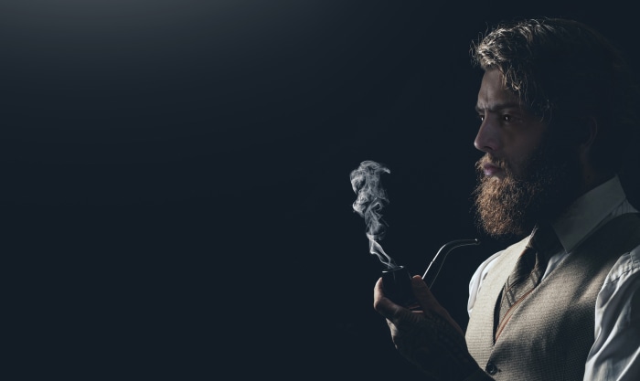 Robert Finster as Sigmund Freud smoking pipe