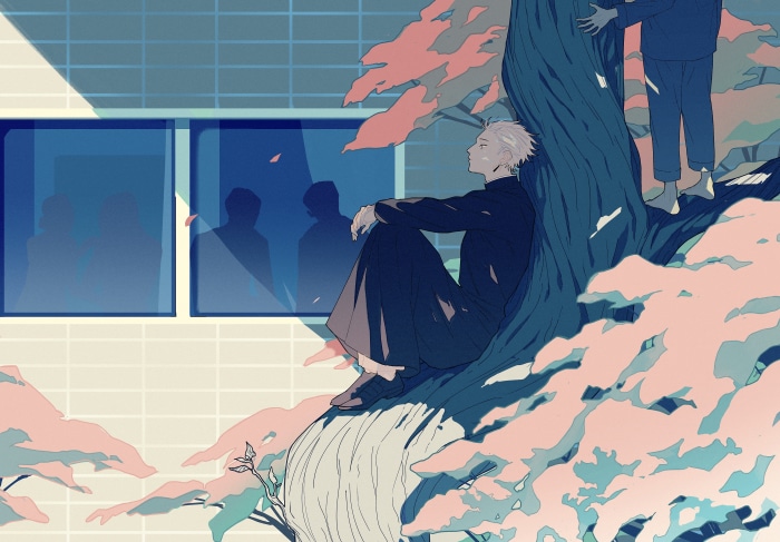 Boy sitting under a tree