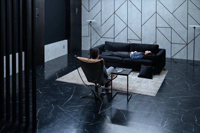 Kate Siegel and Jason Omara in a modern living room
