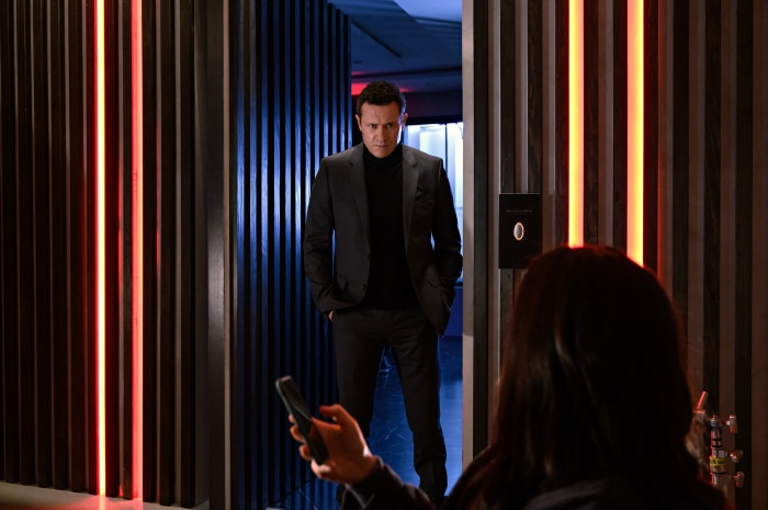 Jason Omara in a dark hallway