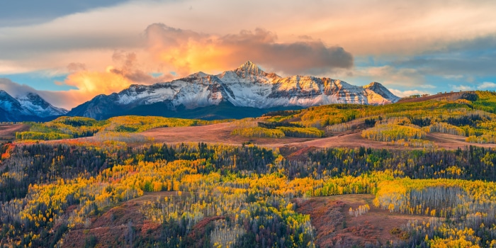 Mountain Landscape with Autumn Trees and Sunset Sky