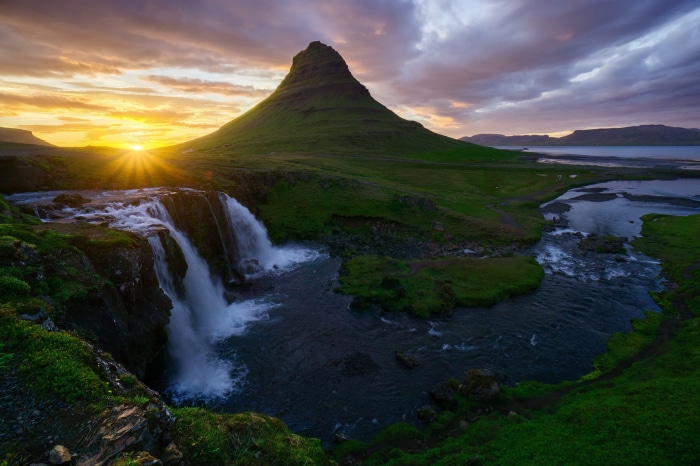 Kirkjufell mountain and waterfall in Iceland at sunrise