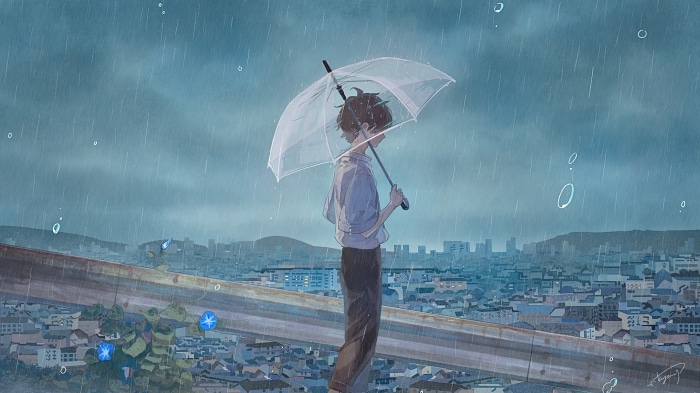 Boy with umbrella in the rain over city
