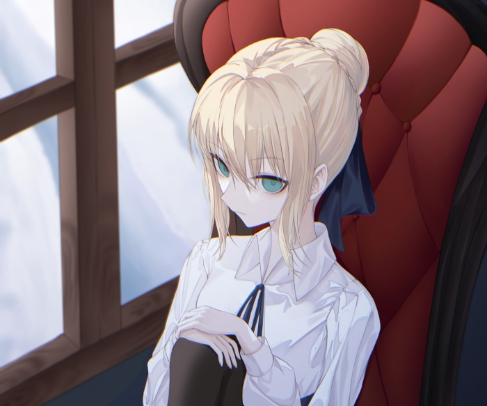 Saber from Fate/Stay Night sitting in a chair