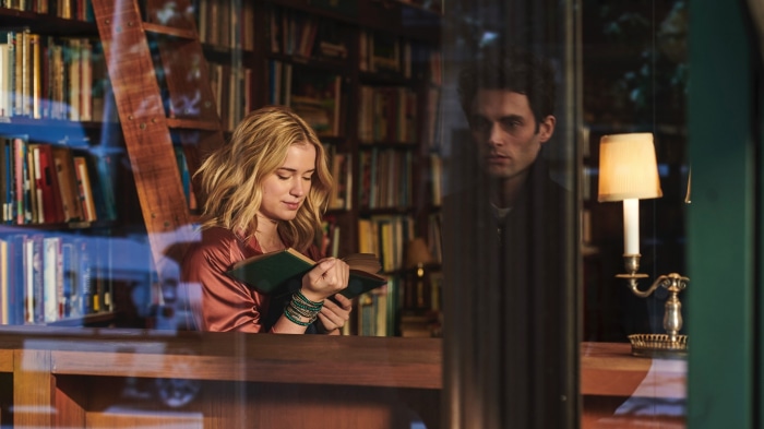 Elizabeth Lail and Penn Badgley in YOU