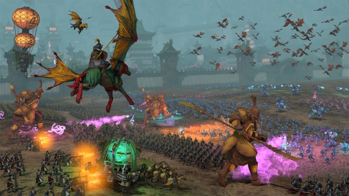 Total War: Warhammer III battle with dragons and armies