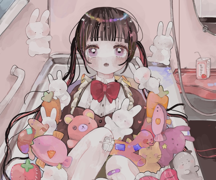 Girl with stuffed animals in a bathtub