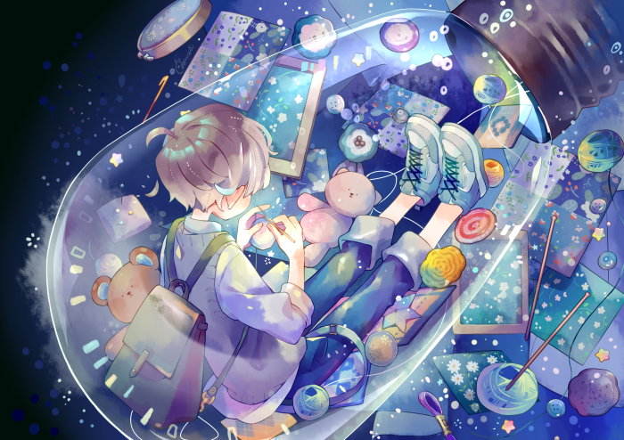Boy inside a light bulb with crafting supplies
