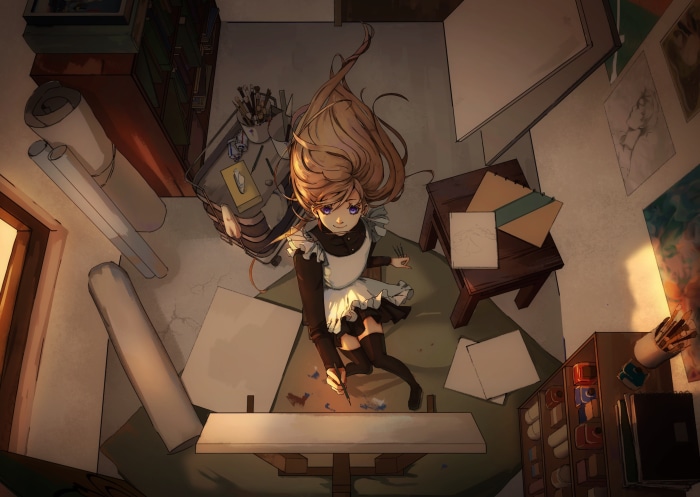 Girl in maid outfit drawing in an art studio