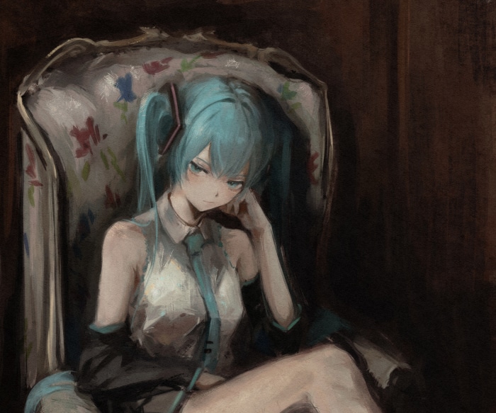 Hatsune Miku sitting in a chair