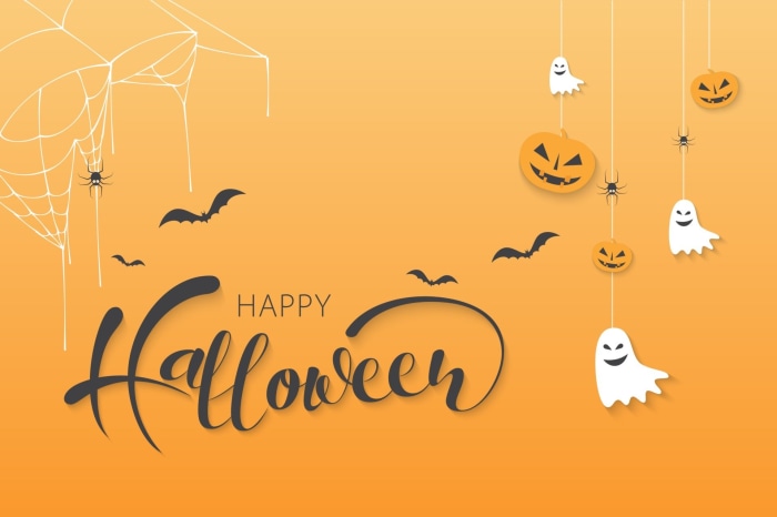 Happy Halloween calligraphy with pumpkins and ghosts