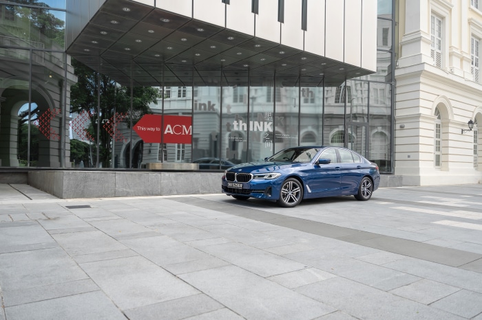 Blue BMW 5 Series 4K parked outside ACM