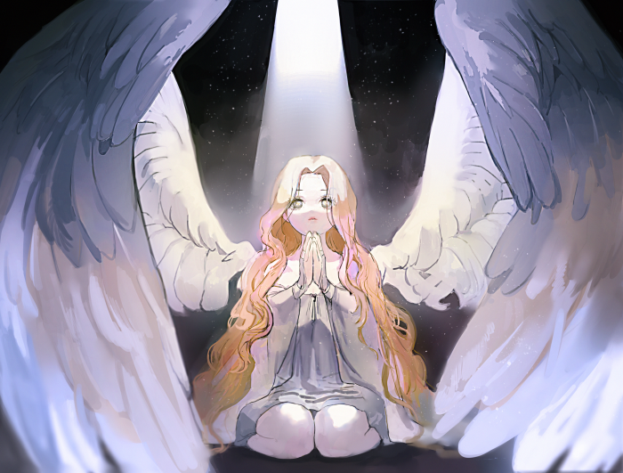 Angel with large wings praying