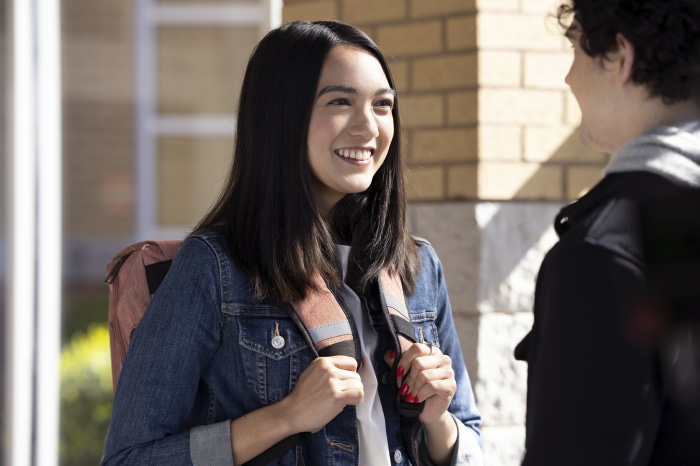 Rachel Marsh with backpack talking to a friend