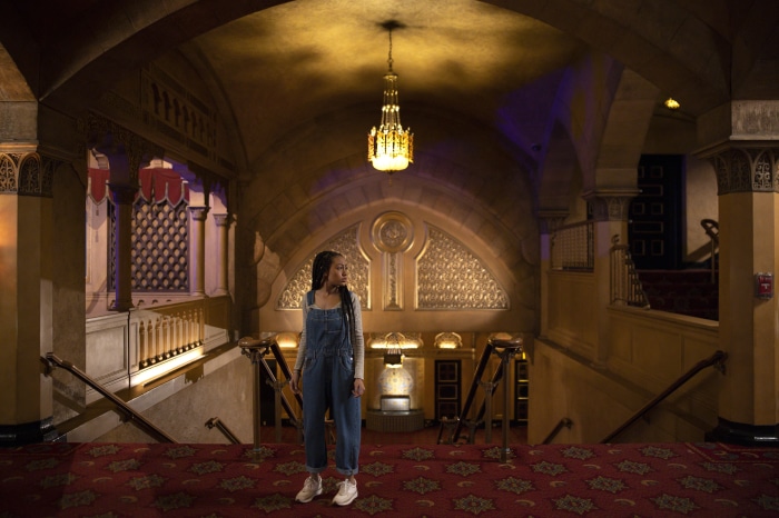 Lexi Underwood in a theater lobby