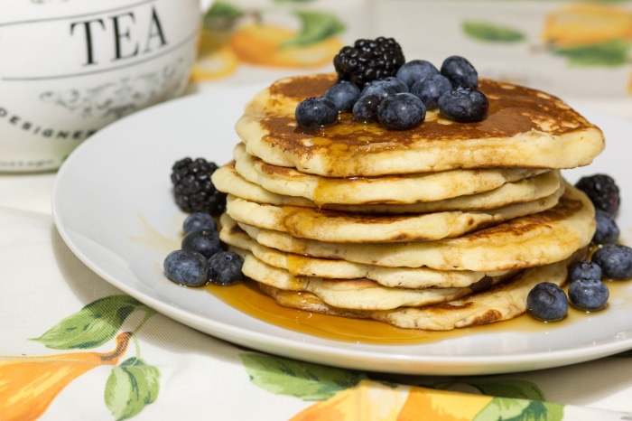 Stack of pancakes with blueberries and blackberries