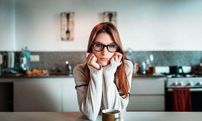 Woman with glasses in a kitchen