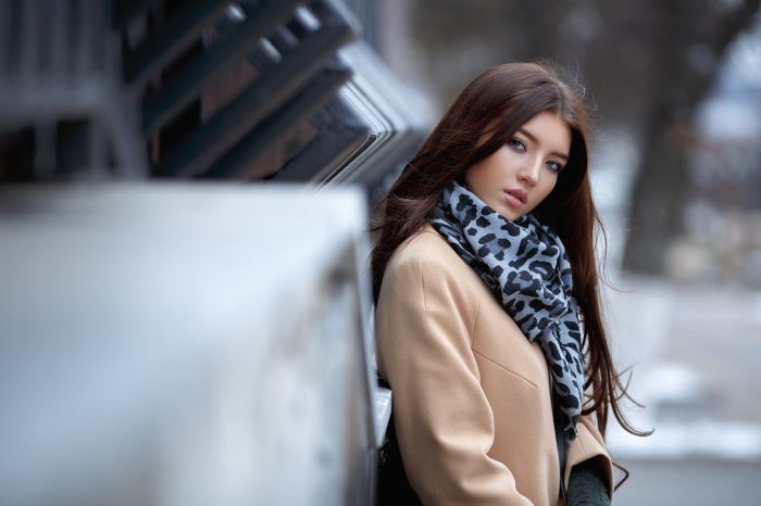 Brunette woman with scarf and coat