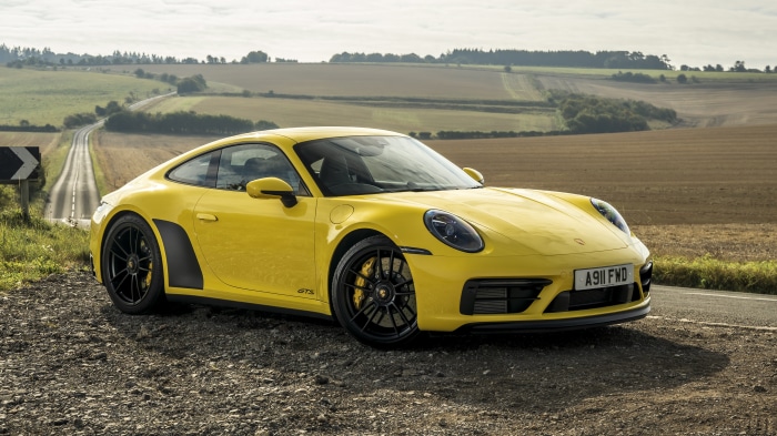 Yellow Porsche 911 Carrera 4S on a Country Road