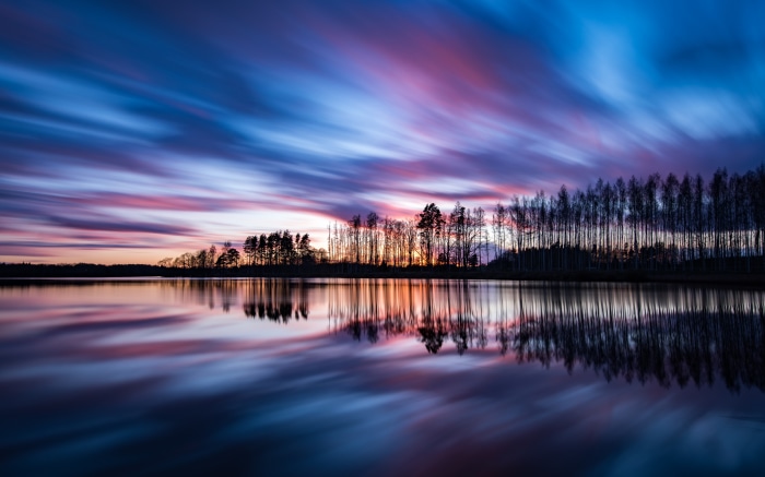Lake reflection at sunset with colorful sky