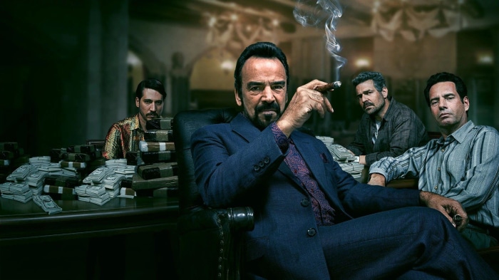 Narcos: Pablo Escobar and his associates with money