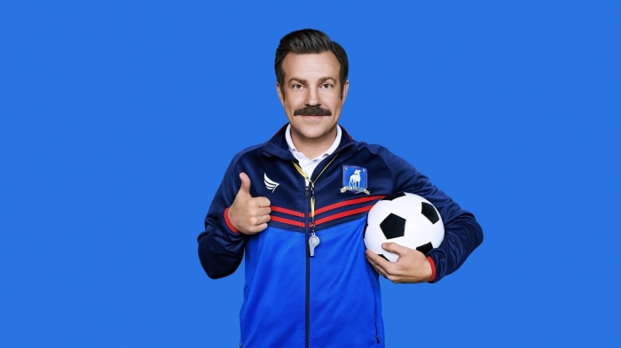 Ted Lasso from Ted Lasso holding a soccer ball