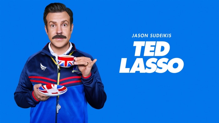 Ted Lasso with Union Jack teacup and saucer