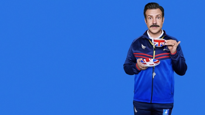 Ted Lasso holding a tea cup