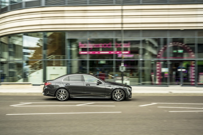 Mercedes-Benz C 300 d AMG Line driving on street