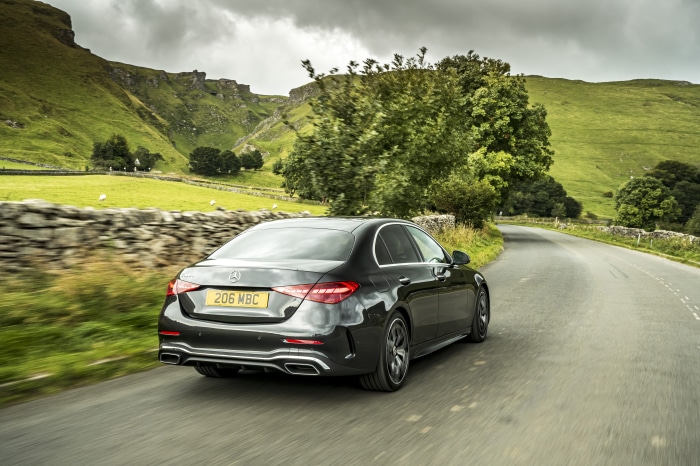 Mercedes-Benz C 300 d AMG Line driving on a country road