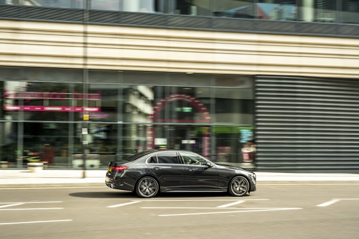 Mercedes-Benz C 300 d AMG Line driving on street