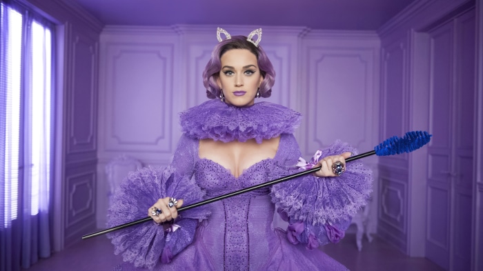 Katy Perry in a purple dress and purple hair