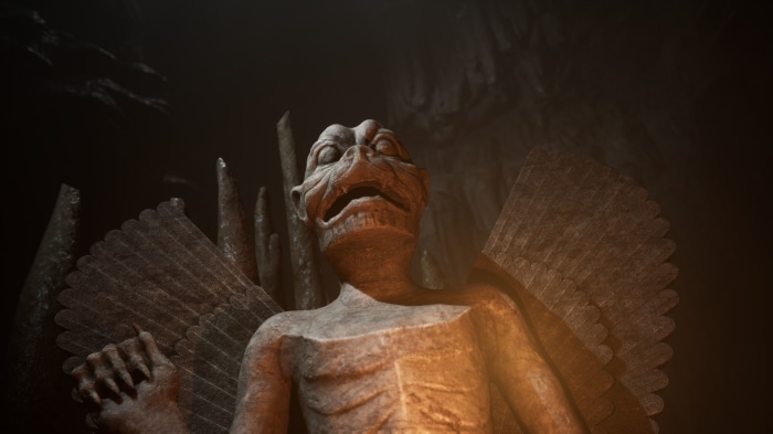 Gargoyle statue in a dark cave