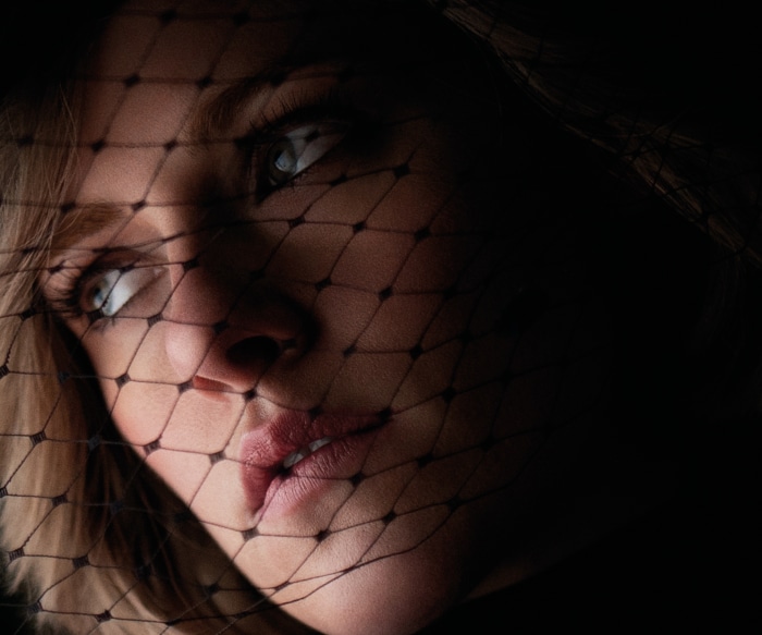 Kristen Stewart behind a black veil