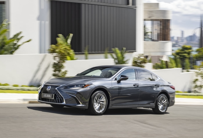 Lexus ES 300H driving on a suburban street