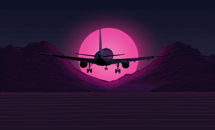 Airplane flying over retro mountains at sunset