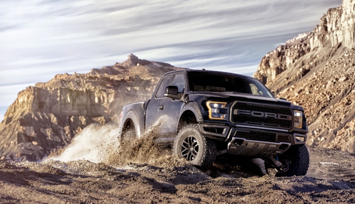 Black Ford Raptor Truck Driving Off-Road