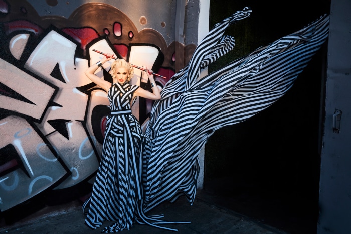 Gwen Stefani in striped dress with chopsticks