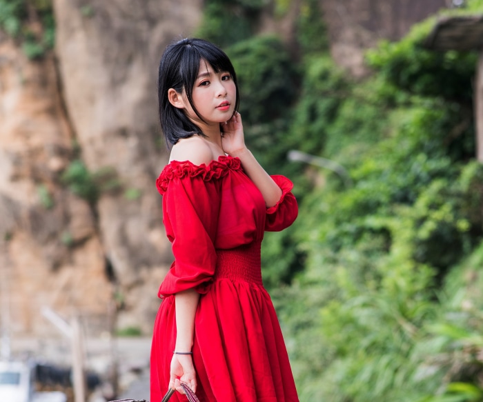 Asian woman in red dress with black hair