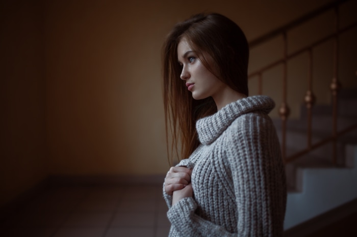 Young woman in a grey sweater