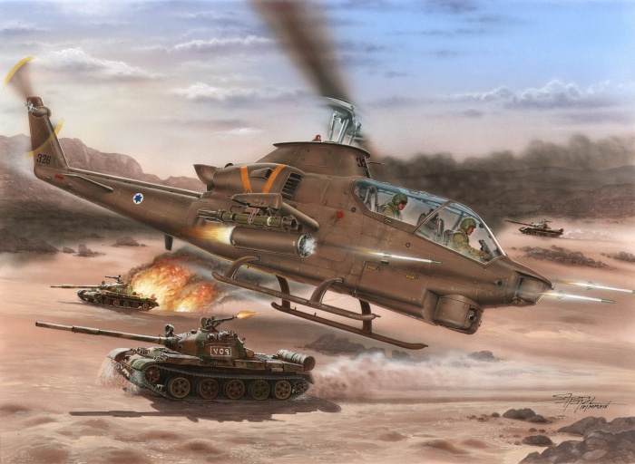 Bell AH-1 Cobra helicopter attacking tanks in desert