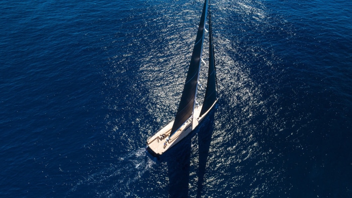 Sailboat sailing on the blue ocean