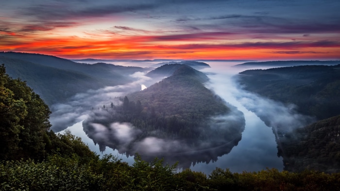 River bend with fog at sunrise in Germany