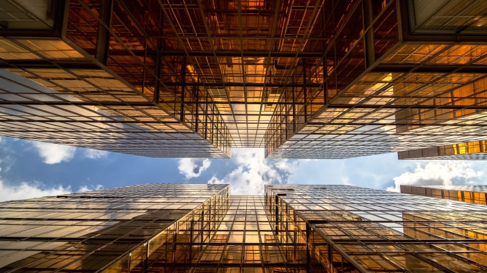 Golden skyscrapers reflecting the sky in Hong Kong