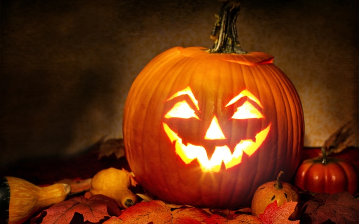 Halloween Jack-O-Lantern with Pumpkins and Leaves