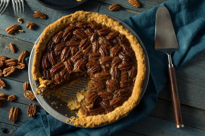 Pecan pie with a slice removed