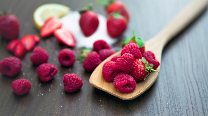Raspberries and Strawberries on a Wooden Spoon