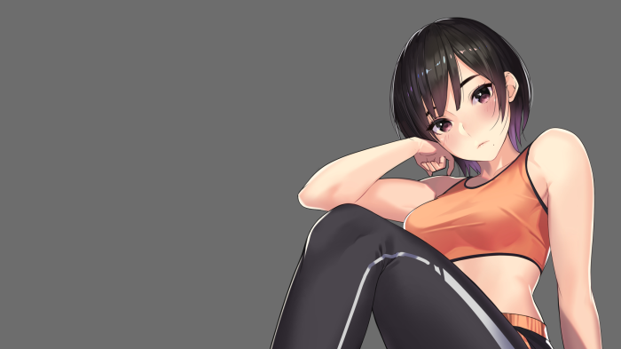 Girl in orange sports bra and black pants