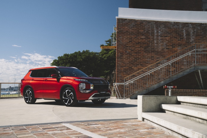 Red Mitsubishi Outlander Exceed SUV parked outdoors